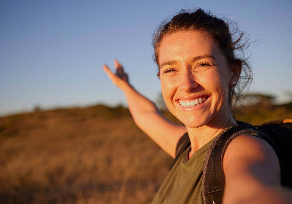 a woman with her arms out in the air