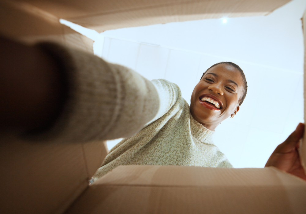 a woman opening a box