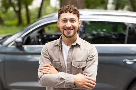 Man in front of car